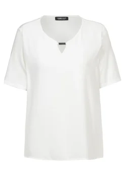 Blouse fluide avec élément décoratif au décolleté