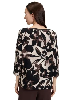 Blouse fluide dense et structurée