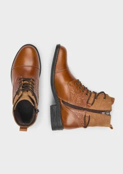 Bottines en cuir marqué