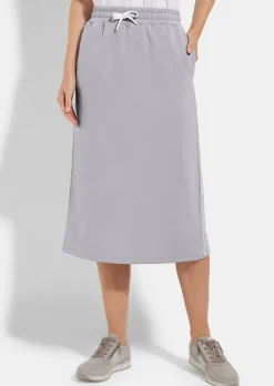 Jupe en sweat avec lien de serrage sous coulisse. En coton et élasthanne.