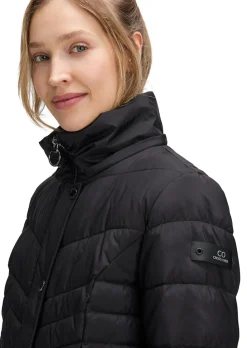 Manteau matelassé avec capuche en tissu fourrure
