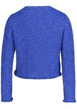 Veste en bouclette avec fils brillants et finitions effilochées